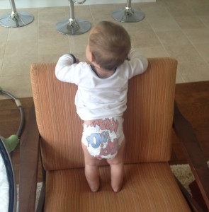 Noah dangerously standing on furniture by himself